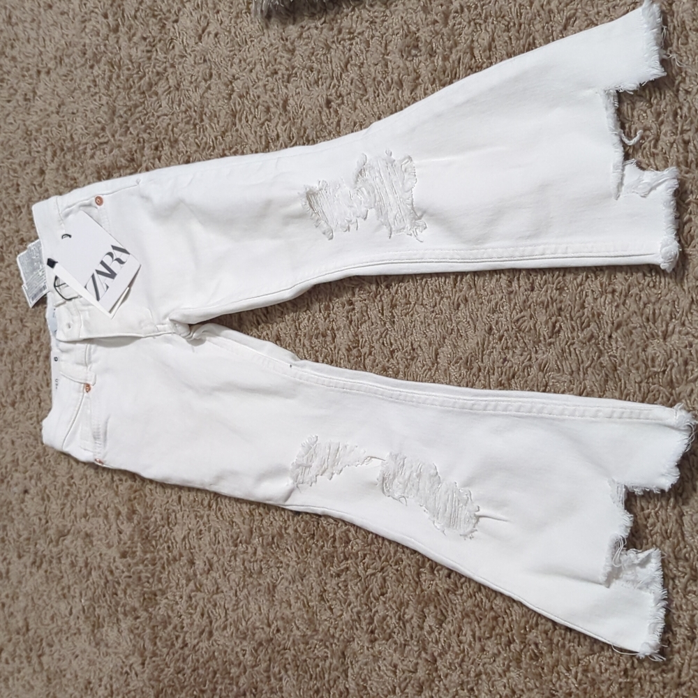 White distressed bell bottom jeans
